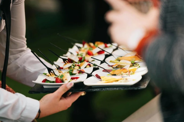A server carrying plated food